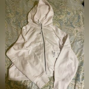 Brand new with tags lululemon scuba sweatshirt.  White.  No flaws.